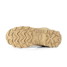 Load image into Gallery viewer, Close-up of a tan shoe sole with tread pattern on a white background