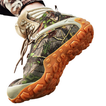 Load image into Gallery viewer, Camouflage hiking boot with orange sole on a white background
